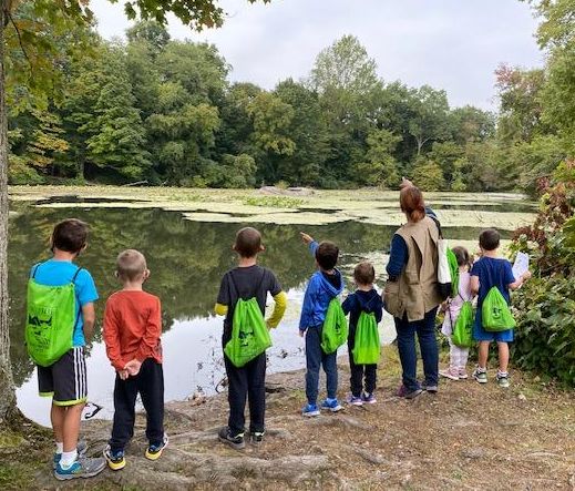 Preschool walk by pond