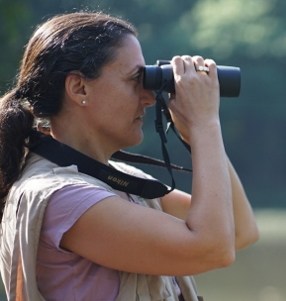 Jocelyn Kleinman looking through binoculars