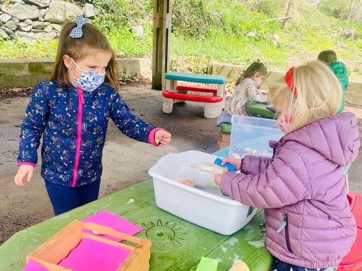 Preschoolers working on sand project during Sheldrake Preschool program.