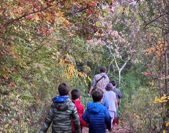 Children hiking in Sheldrake's colorful fall foliage.