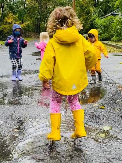 kids jumping in puddles at Sheldrake.