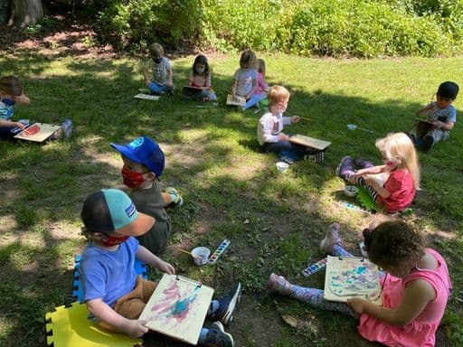 Kids sitting and reading at Sheldrake