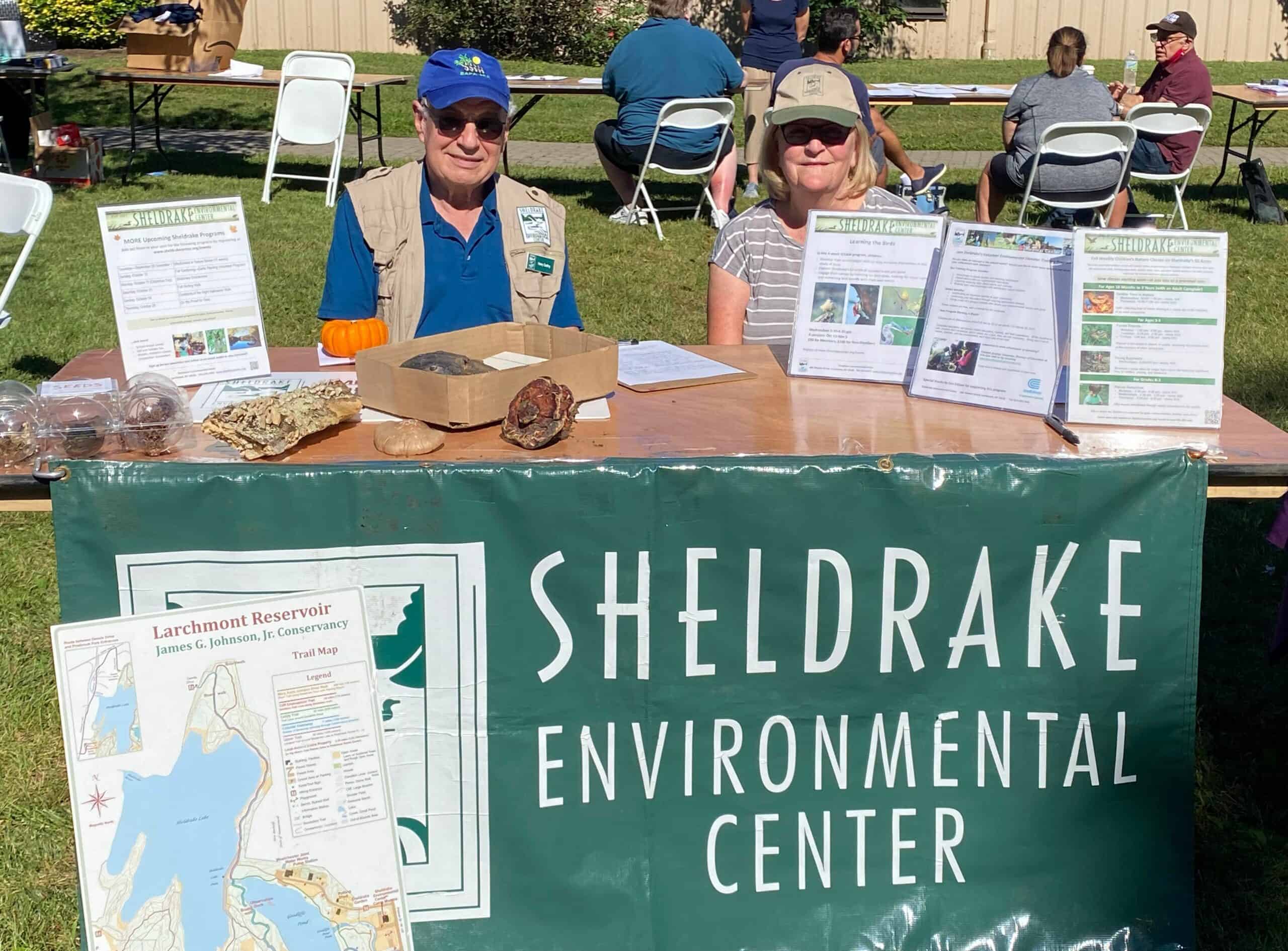 Sheldrake volunteers at Sheldrake table during an event.