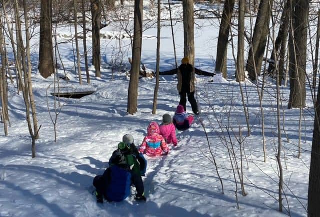 Kids exploring the snow at Sheldrake.